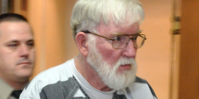 Feb. 2, 2012: In this file photo, Carl V. Ericsson, 73, is led into a Lake County courtroom for a bond hearing on a first-degree murder charge in Madison, S.D. Ericsson was sentenced to life in prison, after pleading guilty but mentally ill last month to second-degree murder.