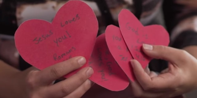 Valentine's cards student Polly Olsen was stopped from handing out on campus by a security officer.
