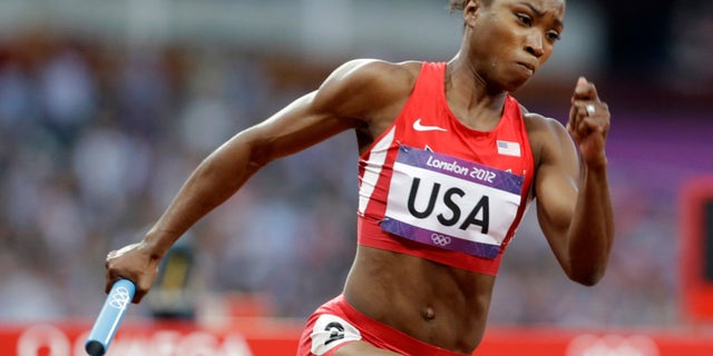 Aug. 9, 2012: In this file photo, United States' Tianna Madison runs in the first leg of the women's 400-meter relay heat at the Summer Olympics in London.