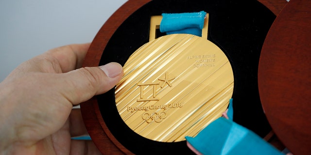 A gold medal for the Pyeongchang 2018 Winter Olympic Games is seen during its unveiling ceremony in Seoul, South Korea, Sept. 21, 2017.  (Reuters)