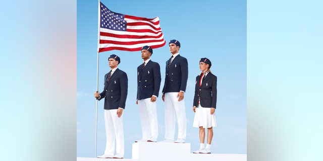 This product image released by Ralph Lauren shows U.S. Olympic athletes, from left, swimmer Ryan Lochte, decathlete Bryan Clay, rower Giuseppe Lanzone and soccer player Heather Mitts modeling the the official Team USA Opening Ceremony Parade Uniform.