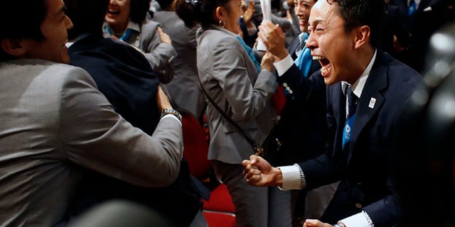 Sept. 7, 2013: Members of the Tokyo 2020 delegation celebrate after Tokyo was awarded the 2020 Olympic Games during the 125th IOC session in Buenos Aires, Argentina.