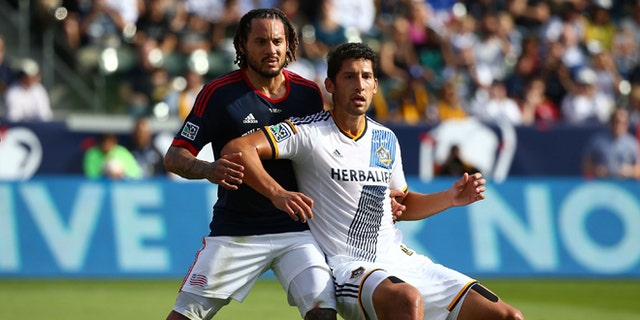 LOS ANGELES, CA - DECEMBER 07:  Omar Gonzalez #4 of the Los Angeles Galaxy and Jermaine Jones #13 of the New England Revolution vie for position prior to a corner kick in the first half during 2014 MLS Cup at StubHub Center on December 7, 2014 in Los Angeles, California. The Galaxy defeated the Revolution 2-1.  (Photo by Victor Decolongon/Getty Images)