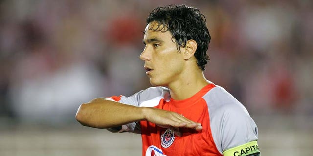 PASADENA, CA - SEPTEMBER 23: Omar Bravo #99 of Chivas de Guadalajara stands for the playing of the Mexican National Anthem prior to their International Club Friendly match against Chivas USA at the Rose Bowl on September 23, 2009 in Pasadena, California. Chivas de Guadalajara defeated Chivas USA 2-0. (Photo by Victor Decolongon/Getty Images)