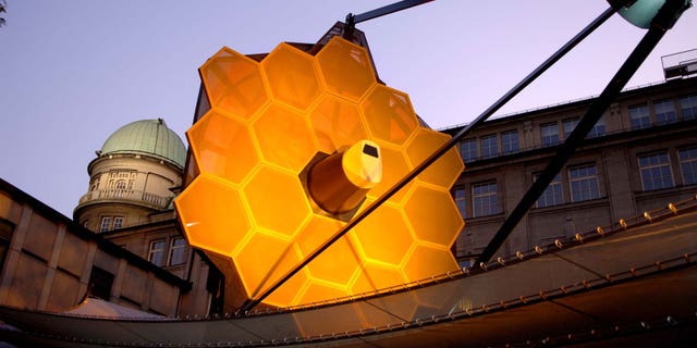 A full-scale model of the James Webb Space Telescope built by the prime contractor, Northrop Grumman, provides a better understanding of the size, scale and complexity of this satellite. The model is constructed mainly of aluminum and steel, weighs 12,000 lb., and is approximately 80 feet long, 40 feet wide and 40 feet tall. The model requires 2 trucks to ship and assembly takes a crew of 12 approximately four days.