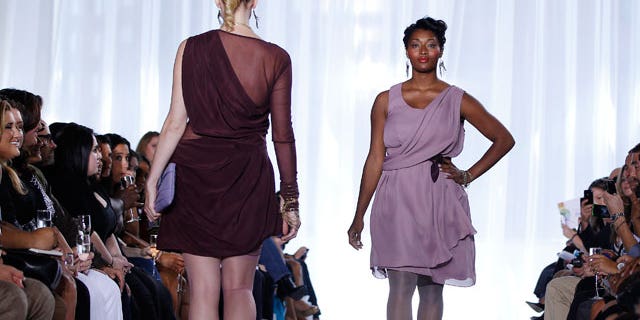 Plus size models work the runway at a fashion show during New York Fashion Week.