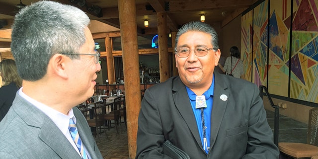 U.S. Associate Deputy Attorney General Bruce Ohris, left, and Santa Clara Pueblo Gov. J. Michael Chavarria.
