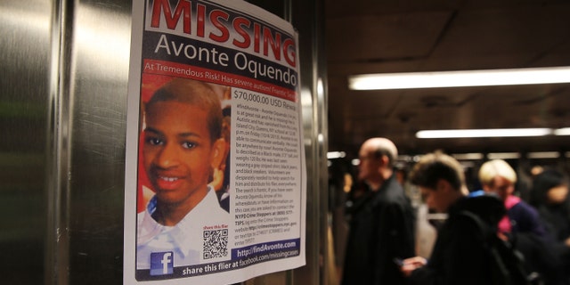 NEW YORK, NY - OCTOBER 21: A poster for a missing autistic 14-year-old named Avonte Oquendo hangs in subway station on October 21, 2013 in New York City. Hundreds of Police, volunteers, friends and family are searching for Avonte who walked out of the Center Boulevard School in Long Island City, Queens on October 4, 2013 and has not been seen since. Family members say that the teen has a fondness for trains and have focused their search along rail yards and in subway stations. (Photo by Spencer Platt/Getty Images)