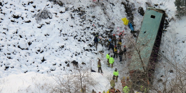 Dec. 30, 2012: Emergency personnel respond to the scene of a multiple fatality accident where a tour bus careened through a guardrail along an icy Oregon highway and fell several hundred feet down a steep embankment.