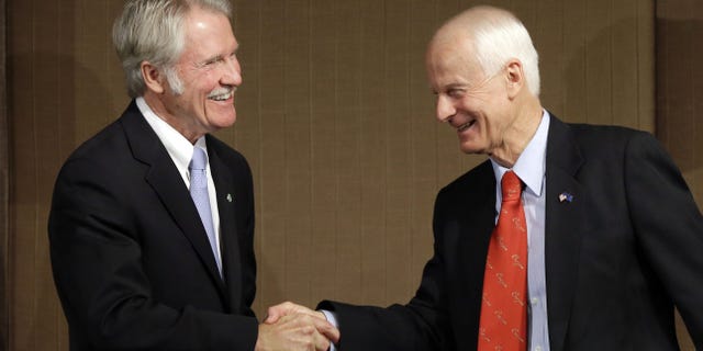Oct. 10, 2014: Oregon Democratic Gov. John Kitzhaber, left, shakes hands with Republican challenger Dennis Richardson.