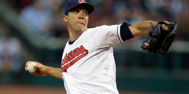 FILE - In this Sept. 24, 2013 file photo, Cleveland Indians starting pitcher Ubaldo Jimenez delivers in the first inning of a baseball game against the Chicago White Sox in Cleveland. A person familiar with the situation said Monday, Feb. 17, 2014, free-agent pitcher Ubaldo Jimenez and the Baltimore Orioles have agreed to a contract, pending a physical. (AP Photo/Tony Dejak, File)