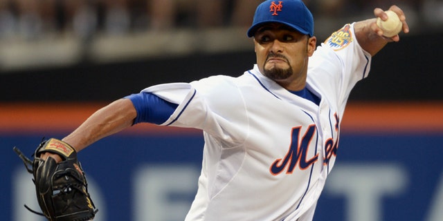 FILE - In this file photo taken Aug. 11, 2012, New York Mets' Johan Santana pitches in baseball game in New York. The two-time AL Cy Young Award winner has agreed to a minor league contract with the Baltimore Orioles, in a deal announced Tuesday, March 4, 2014, as he tries to come back from the second major operation on his left shoulder. (AP Photos/Henny Ray Abrams, file)