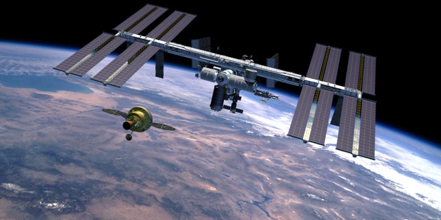 The Orion spacecraft, intended to return humans to the moon and prepare for future voyages to Mars and other destinations in our solar system. This artist's rendering represents a concept of the Orion spacecraft approaching the International Space Station in Earth-orbit.
