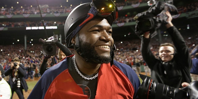 Boston Red Sox designated hitter, David Ortiz, celebrates the team's World Series victory, Oct. 30, 2013.