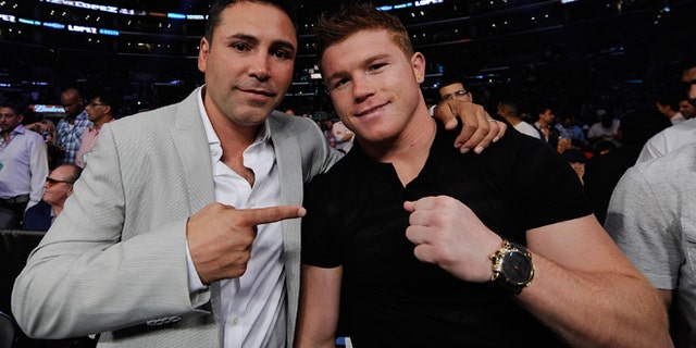 Oscar De La Hoya and Mexican boxer Canelo Alvarez on June 23, 2012 in Los Angeles, California.