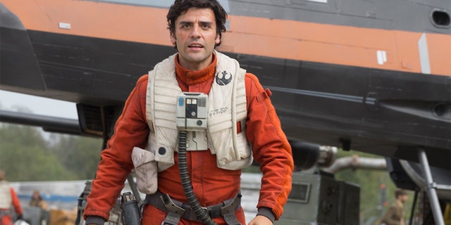 This photo provided by Disney/Lucasfilm shows Oscar Isaac as Poe Dameron in a scene from "Star Wars: The Force Awakens," directed by J. J. Abrams. The new film releases in U.S. theaters on Dec. 18, 2015. (David James/Disney/Lucasfilm via AP)