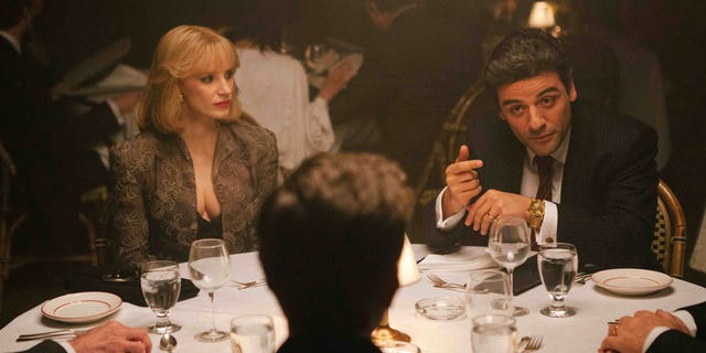In this image released by A24 Films, Jessica Chastain, left, and Oscar Isaac appear in a scene from "A Most Violent Year." Chastain was nominated for a Golden Globe for best supporting actress in a drama for her role in the film on Thursday, Dec. 11, 2014. The 72nd annual Golden Globe awards will air on NBC on Sunday, Jan. 11. (AP Photo/A24 Films, Atsushi Nishijima)