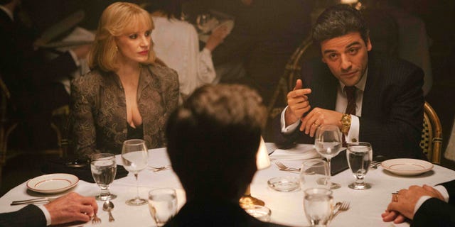 In this image released by A24 Films, Jessica Chastain, left, and Oscar Isaac appear in a scene from "A Most Violent Year." Chastain was nominated for a Golden Globe for best supporting actress in a drama for her role in the film on Thursday, Dec. 11, 2014. The 72nd annual Golden Globe awards will air on NBC on Sunday, Jan. 11. (AP Photo/A24 Films, Atsushi Nishijima)