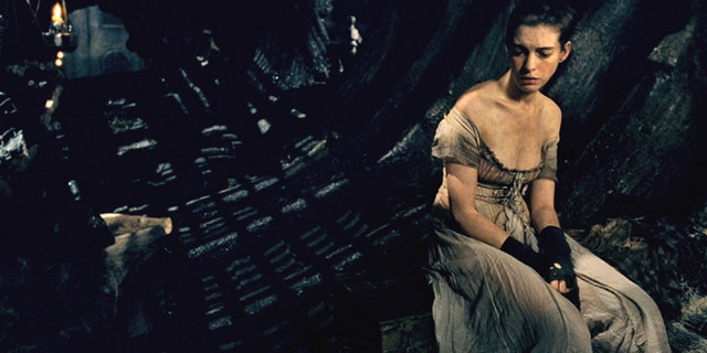 This image released by Universal Pictures shows Anne Hathaway as Fantine in a scene from "Les Misérables." The costumes for the film were designed by Spanish designer Paco Delgado. Delgado is nominated for an Academy Award for his costumes from the film. The 85th Academy Awards will be held on Sunday, Feb. 24. (AP Photo/Universal Pictures)