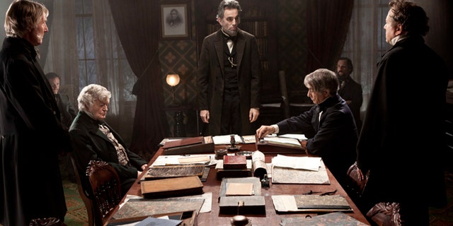 FILE - This undated publicity photo released by DreamWorks and Twentieth Century Fox, shows Daniel Day-Lewis, center rear, as Abraham Lincoln, in a scene from the film, "Lincoln." A Congressman who saw a flaw in the movie âLincolnâ says he is pleased the screenwriter has conceded an inaccuracy in its portrayal of an 1865 vote on slavery. U.S. Rep. Joe Courtney, a Democrat who represents eastern Connecticut, said Friday, Feb. 8, 2013, he is still hoping that a correction can be made before the film is released on DVD. (AP Photo/DreamWorks, Twentieth Century Fox, David James, File)