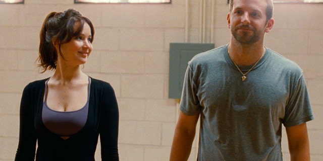 FILE -This film image released by The Weinstein Company shows Jennifer Lawrence, left, and Bradley Cooper in "Silver Linings Playbook." Lawrence is nominated for an Academy Award for best actress for âSilver Linings Playbook." The 85th Academy Awards are held in Los Angeles on Sunday, Feb. 24. (AP Photo/The Weinstein Company, JoJo Whilden, File)