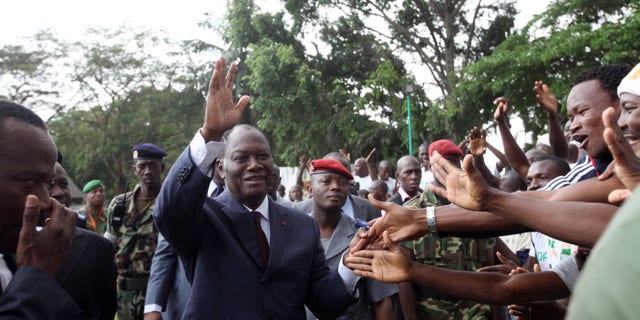 Dec. 30, 2010: Alassane Ouattara, centre, opposition leader greet his supporters in Abidjan, Ivory Coast. Ouattara is widely regarded as being the winner of recent presidential elections, although incumbent leader Laurent Gbagbo refuses to relinquish power. The United Nations accused Gbagbo's security forces of blocking access to sites thought to hide the bodies of up to 80 victims amidst reports that political opponents were abducted by security forces loyal to Gbagbo after the disputed election.