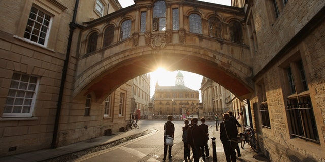 Students walk under the Bridge of Sighs along New College Lane on March 22, 2012 in Oxford, England.