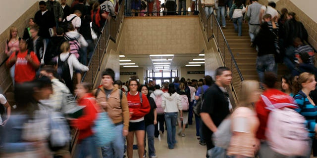 ** ADVANCE FOR SUNDAY, AUG. 19 **Students move between classes at Dodge City High School in Dodge City, Kan., Wednesday, April 4, 2007. Seventy per cent of the students at the school are Hispanic. (AP Photo/Orlin Wagner)