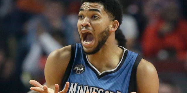Minnesota Timberwolves center Karl-Anthony Towns reacts to a call during the first half of an NBA basketball game against the Chicago Bulls on Saturday, Nov. 7, 2015, in Chicago. (AP Photo/Nam Y. Huh)