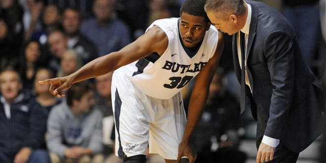 Dec 31, 2015; Indianapolis, IN, USA; Butler University Bulldogs head coach Chris Holtmann (R) talks to guard Kelan Martin (30) during a stoppage in play against the Providence College Friars at Hinkle Fieldhouse. Mandatory Credit: Thomas Joseph-USA TODAY Sports