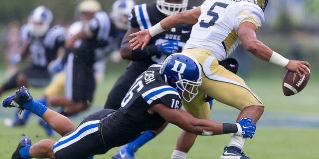 FILE - In this Sept. 26, 2015, file photo, Duke's Jeremy Cash tackles Georgia Tech's Justin Thomas for a loss during the first half of an NCAA college football game, in Durham, N.C. Georgia Tech fell out of the Top 25 with its loss to Duke. (AP Photo/Rob Brown)