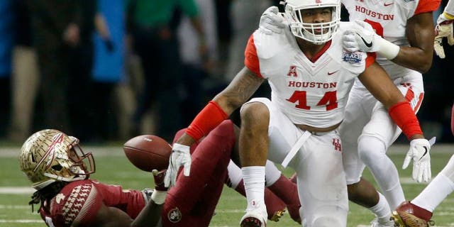 Dec 31, 2015; Atlanta, GA, USA; Houston Cougars linebacker Elandon Roberts (44) celebrates with cornerback William Jackson III (3) after a tackle against Florida State Seminoles running back Dalvin Cook (4) in the first quarter of the 2015 Chick-fil-A Peach Bowl at the Georgia Dome. Mandatory Credit: Jason Getz-USA TODAY Sports