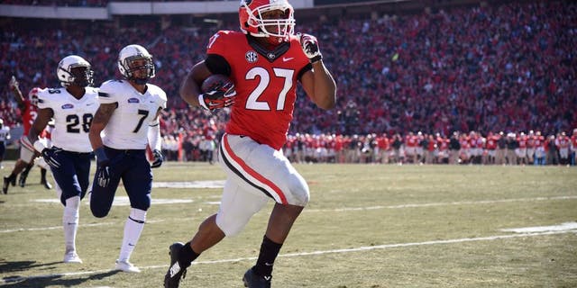 Nov 22, 2014; Athens, GA, USA; Georgia Bulldogs running back Nick Chubb (27) runs 83 yards for a touchdown against the Charleston Southern Buccaneers during the first quarter at Sanford Stadium. Mandatory Credit: Dale Zanine-USA TODAY Sports