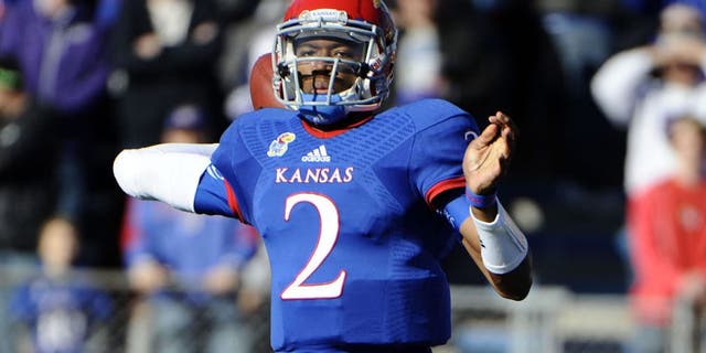 Nov 30, 2013; Lawrence, KS, USA; Kansas Jayhawks quarterback Montell Cozart (2) throws a pass against the Kansas State Wildcats in the first half at Memorial Stadium. Mandatory Credit: John Rieger-USA TODAY Sports
