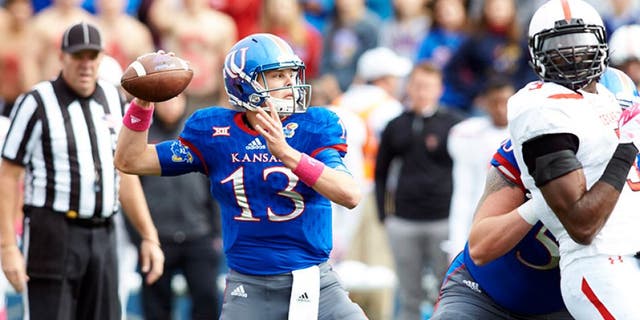 Oct 17, 2015; Lawrence, KS, USA; DUPLICATE Kansas Jayhawks quarterback Ryan Willis (13) throws the ball down the field against Texas Tech at Memorial Stadium. Mandatory Credit: Gary Rohman/MLS/USA TODAY Sports