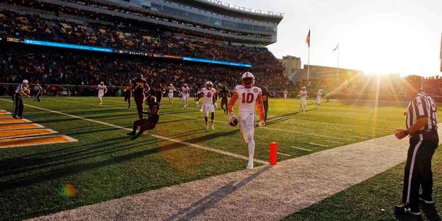Nebraska defensive back Joshua Kalu crosses the goal line as he returns an interception 41-yards for a touchdown during the second half Saturday, Oct. 17, 2015, in Minneapolis. Nebraska won 48-25.