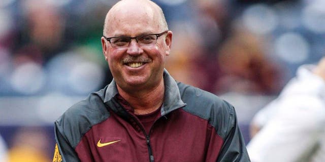 Dec 27, 2013; Houston, TX, USA; Minnesota Golden Gophers head coach Jerry Kill walks on the field before the Texas Bowl against the Syracuse Orange at Reliant Stadium.