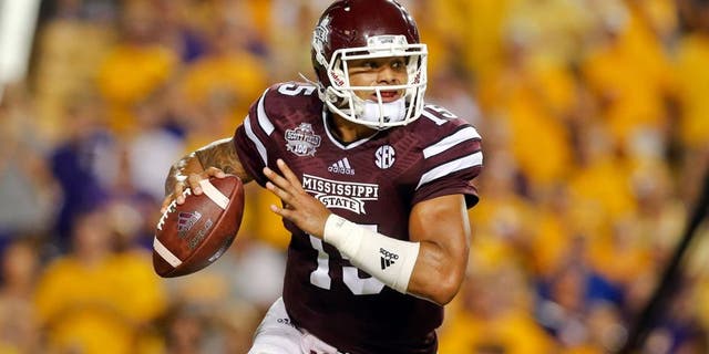 Sep 20, 2014; Baton Rouge, LA, USA; Mississippi State Bulldogs quarterback Dak Prescott (15) looks to pass against the LSU Tigers during the third quarter of a game at Tiger Stadium. Mandatory Credit: Derick E. Hingle-USA TODAY Sports
