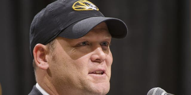 Barry Odom talks to a crowd gathered at Mizzou Arena as he is announced as the new head coach for the Missouri NCAA college football team Friday, Dec. 4, 2015, in Columbia, Mo. (AP Photo/L.G. Patterson)