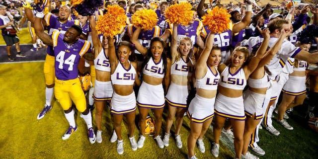 Sep 27, 2014; Baton Rouge, LA, USA; LSU Tigers players and cheerleaders celebrate following a win against the New Mexico State Aggies in a game at Tiger Stadium. LSU defeated New Mexico State 63-7. Mandatory Credit: Derick E. Hingle-USA TODAY Sports