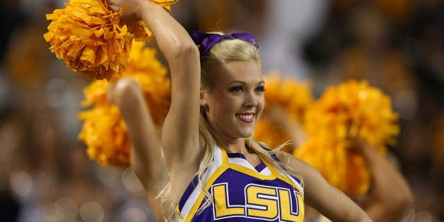 Aug 31, 2013; Arlington, TX, USA; LSU Tigers cheerleaders preform on the sidelines during the game against Texas Christian Horned Frogs at AT&T Stadium. Mandatory Credit: Matthew Emmons-USA TODAY Sports