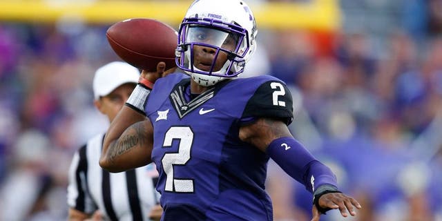 Oct 18, 2014; Fort Worth, TX, USA; TCU Horned Frogs quarterback Trevone Boykin (2) scrambles out of the pocket against the Oklahoma State Cowboys at Amon G. Carter Stadium. Mandatory Credit: Matthew Emmons-USA TODAY Sports