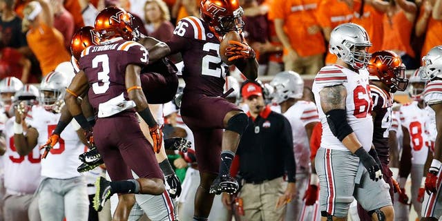 Sep 7, 2015; Blacksburg, VA, USA; Virginia Tech Hokies safety Desmond Frye (26) celebrates his interception during the second quarter against the Ohio State Buckeyes at Lane Stadium. Mandatory Credit: Peter Casey-USA TODAY Sports
