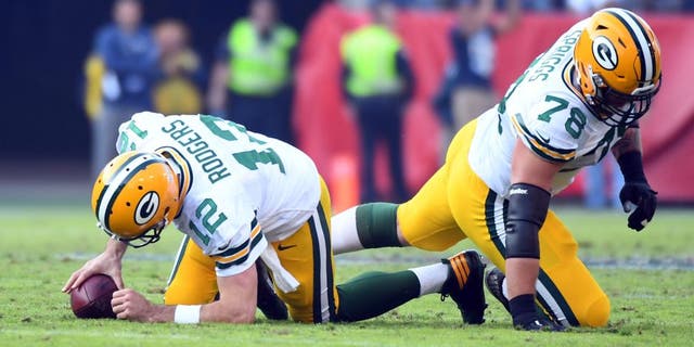 Nov 13, 2016; Nashville, TN, USA; Green Bay Packers quarterback Aaron Rodgers (12) and tackle Jason Spriggs (78) react after a sack during the second half against the Tennessee Titans at Nissan Stadium. The Titans won 47-25. Mandatory Credit: Christopher Hanewinckel-USA TODAY Sports
