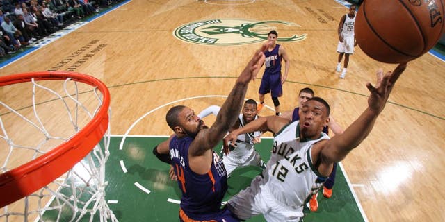 Jabari Parker of the Milwaukee Bucks shoots the ball Phoenix Suns.