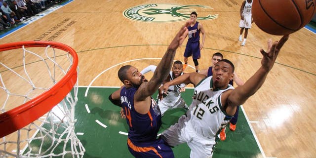 Jabari Parker of the Milwaukee Bucks shoots the ball Phoenix Suns.