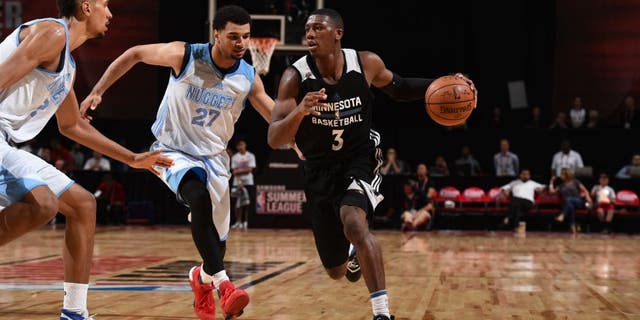 Kris Dunn of the Minnesota Timberwolves drives to the basket against the Denver Nuggets during the 2016 Las Vegas Summer League.