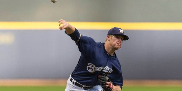 The Milwaukee Brewers' Chase Anderson pitches to a Philadelphia Phillies batter during the first inning Saturday, April 23, 2016, in Milwaukee.