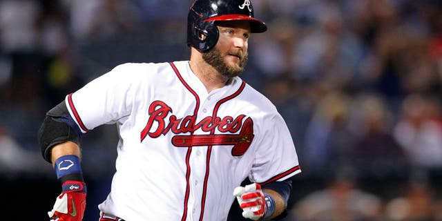 Sep 1, 2015; Atlanta, GA, USA; Atlanta Braves catcher A.J. Pierzynski (15) hits a single against the Miami Marlins in the seventh inning at Turner Field. Mandatory Credit: Brett Davis-USA TODAY Sports