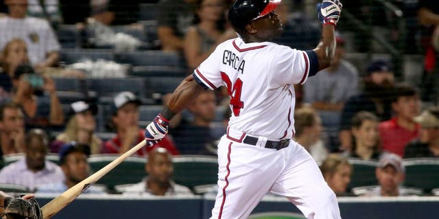 Aug 6, 2015; Atlanta, GA, USA; Atlanta Braves right fielder Adonis Garcia (24) hits a two-run home run in the fifth inning of their game against the Miami Marlins at Turner Field. The Braves won 9-8. Mandatory Credit: Jason Getz-USA TODAY Sports